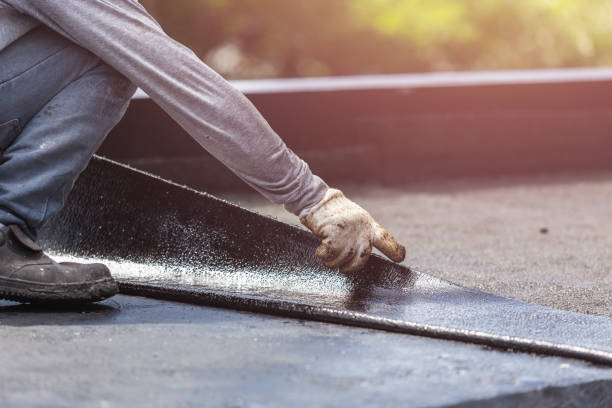 Professional Basement Waterproofing technician working in Belcourt, ND